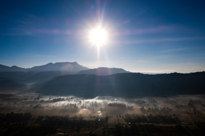 Scenic view of silhouette mountains against sky during sunset