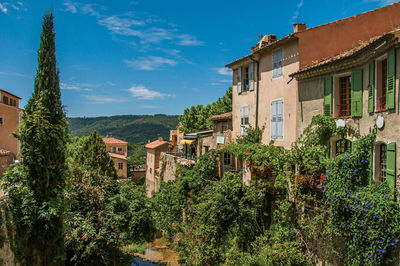 View of houses near creek and bluff at  moustiers-sainte-marie, in the french provence.