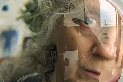 Reflection of man in mirror