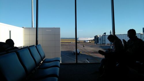 View of airplane at airport runway