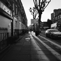 City street amidst buildings against sky