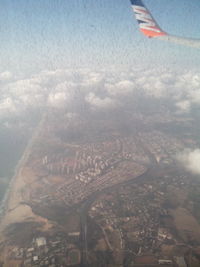 Aerial view of city against sky