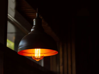 Low angle view of illuminated pendant lights