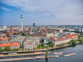 High angle view of buildings and river against sky