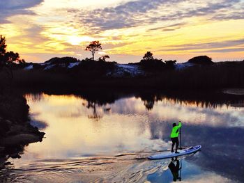 Scenic view of lake at sunset