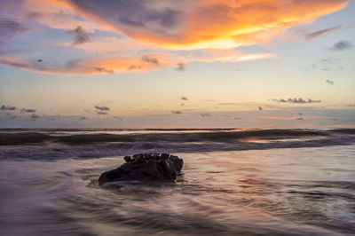 Scenic view of sea against sky during sunset