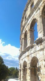 Low angle view of historical building against blue sky