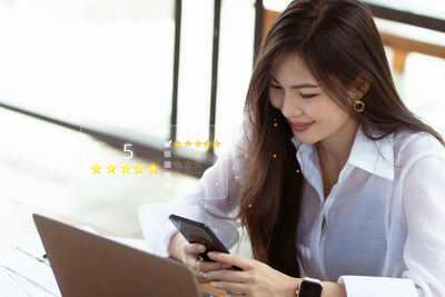 Businesswoman using mobile phone