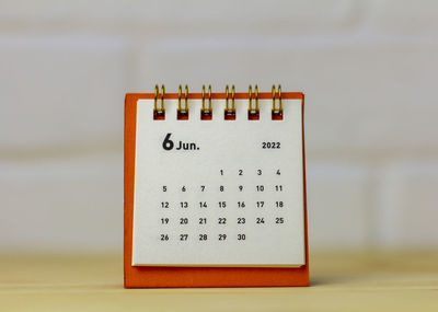 Desk calendar for june 2022 table with copy space.