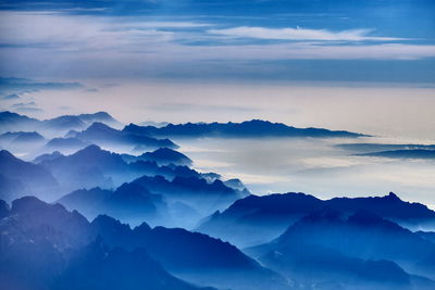 Scenic view of mountains against dramatic sky