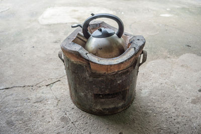 High angle view of kettle on wood burning stove