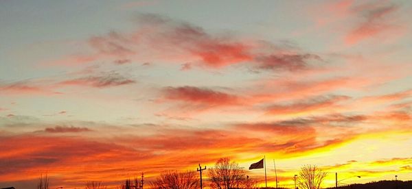 Low angle view of cloudy sky at sunset