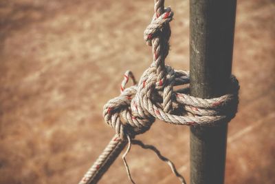 Close-up of rope tied to pole