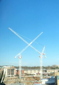 Electricity pylon against clear blue sky