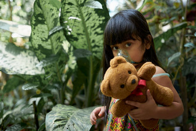 Portrait of a boy holding toy