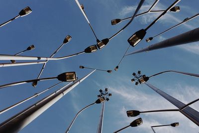 Directly below shot of street lights against sky