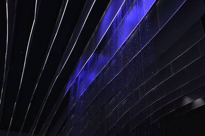 Low angle view of illuminated lights at night