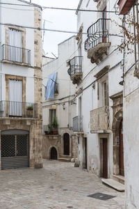 Alley amidst buildings in city