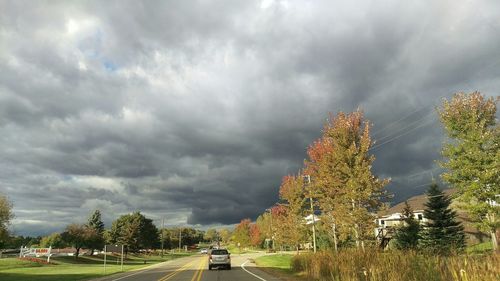 View of road against cloudy sky