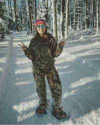 Portrait of young woman in snow