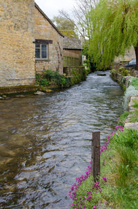 View of stream amidst houses