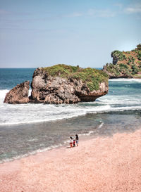 Scenic view of beach against clear sky