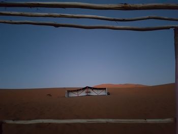 Scenic view of desert against clear sky