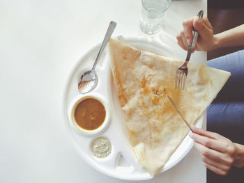 High angle view of woman holding ice cream