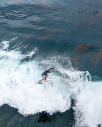 Man splashing water in sea