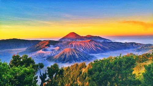 Scenic view of mountains against sky during sunset