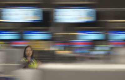 Blurred motion of woman looking at train