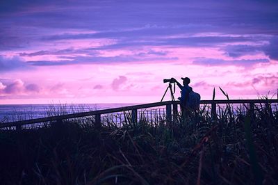 Man photographing at sea