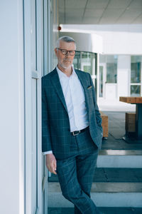 Full length of a young man standing at home