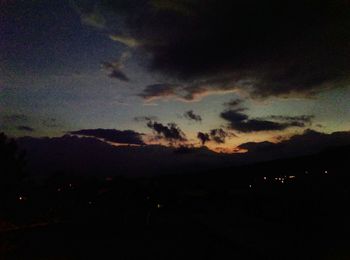 Scenic view of silhouette landscape against sky at night