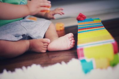 Boy playing with toy at home