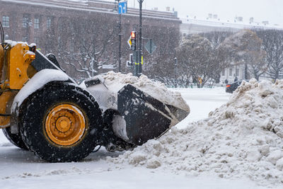 Saint-petersburg, russia. - december 04, 2021. snow-plowing equipment taking part in snow removal 