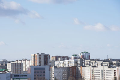 Buildings in city against sky