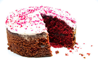 Close-up of cake on plate against white background