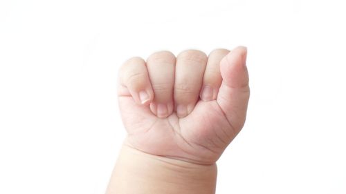 Close-up of human hand against white background