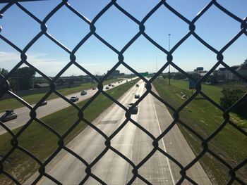 Full frame shot of chainlink fence against sky