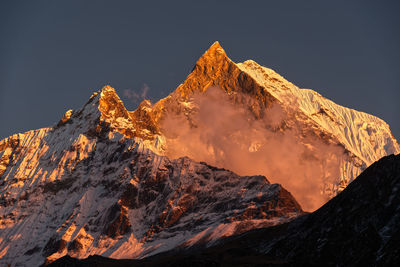 Scenic view of volcanic mountain against sky