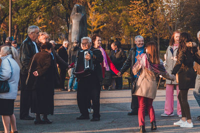 Group of people standing by tree