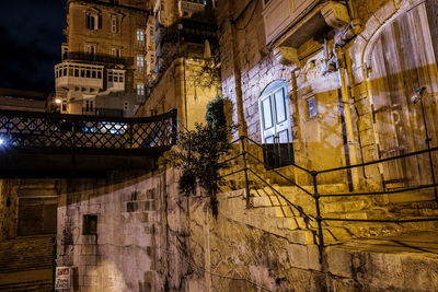 Low angle view of illuminated building at night