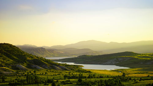 Scenic view of landscape against sky during sunset