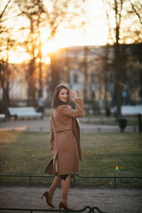 Young woman standing on road