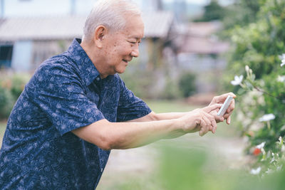 Side view of man standing outdoors