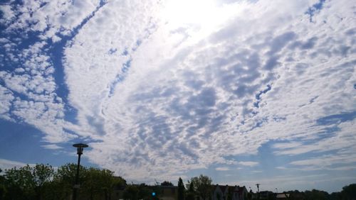 Low angle view of street light against sky