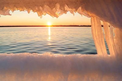 Scenic view of sea against sky during sunset