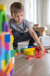 Boy playing with toy blocks