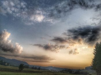 Scenic view of landscape against sky during sunset